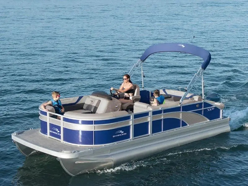 family cruising on a lake in a pontoon boat 