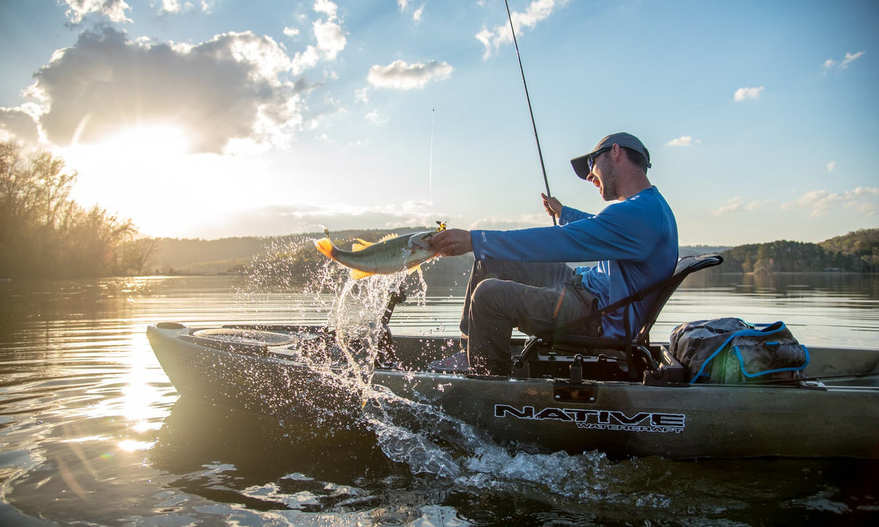 Person fishing in a Native Slayer Max 12.5 kayak 