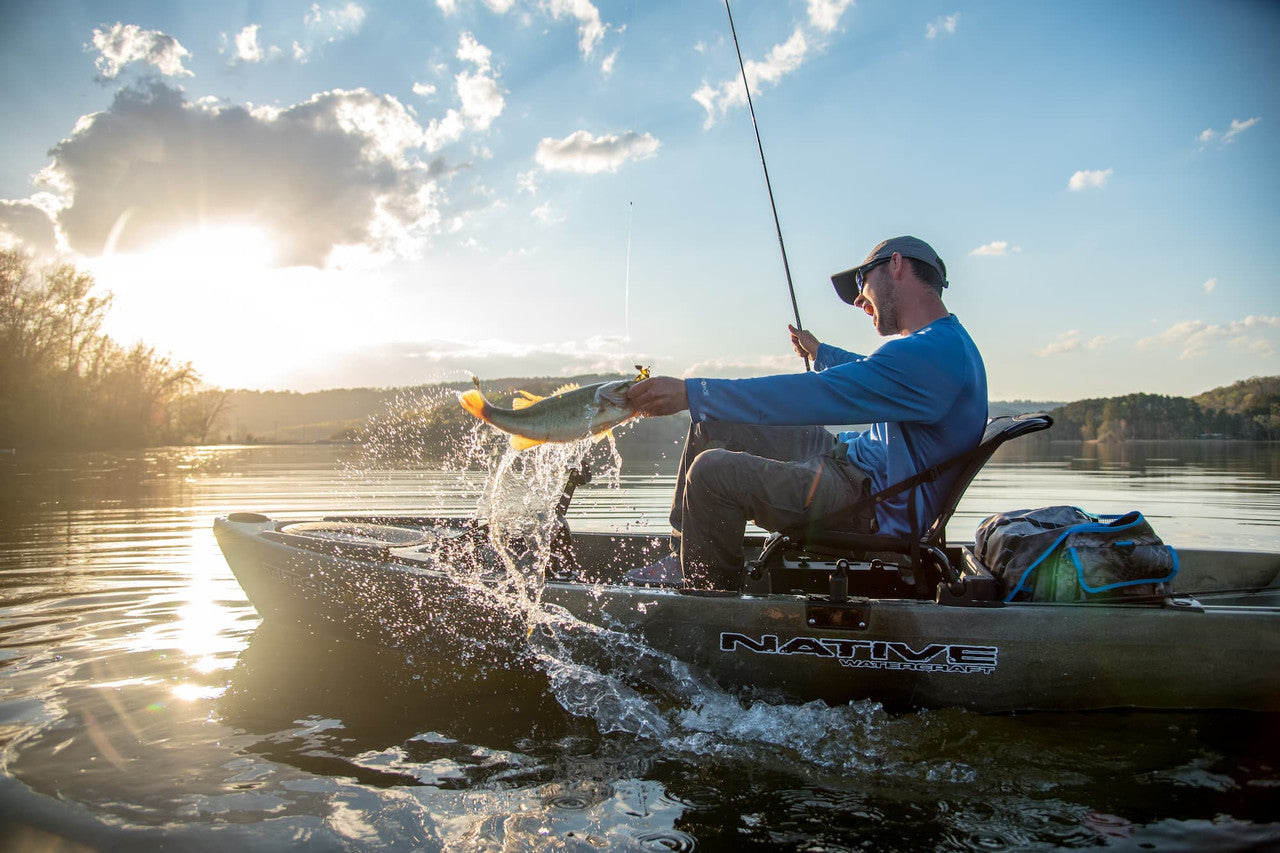 Person fishing in a Native Slayer Max 12.5 kayak 