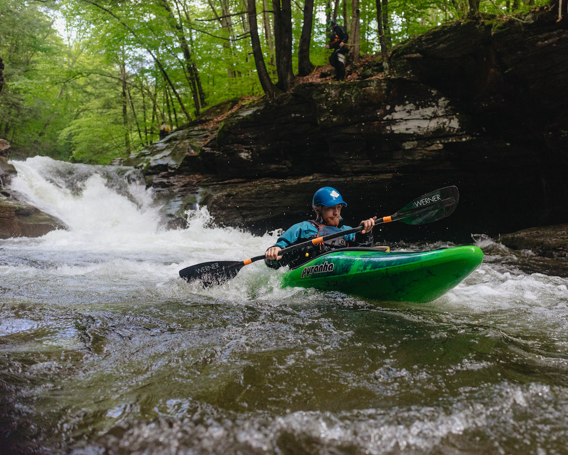 Man white water kayaking in Pyranha kayak 